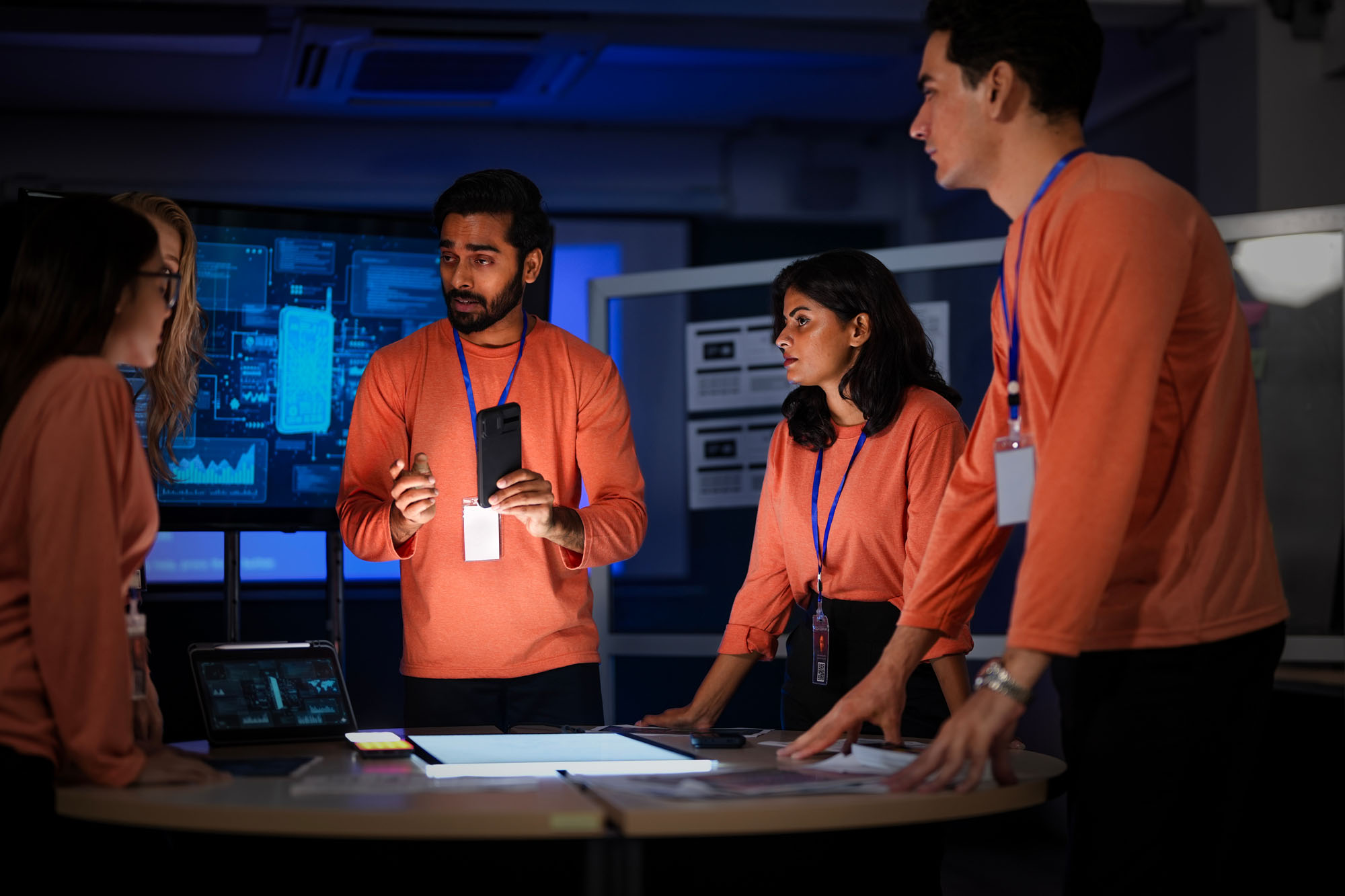 A cybersecurity team in a Security Operations Center analyzes a